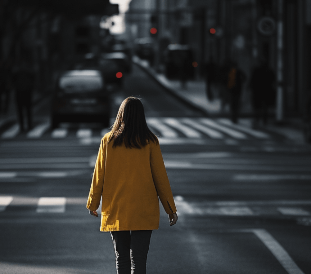 A woman walking across a street